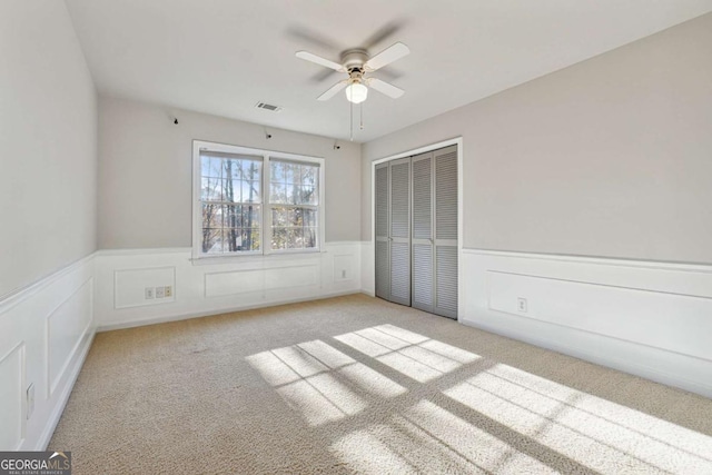 760 Woodrow Dr, Lawrenceville, GA 30043 - unfurnished bedroom featuring visible vents, a wainscoted wall, a closet, and carpet floors