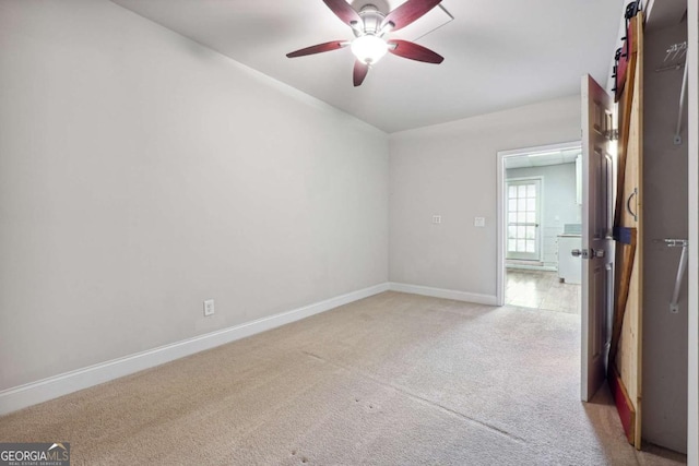 760 Woodrow Dr, Lawrenceville, GA 30043 - spare room featuring ceiling fan, light carpet, and baseboards