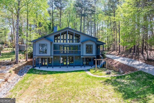 1762 Green Rd, Buford, GA 30518 - back of property featuring a yard, an outdoor fire pit, stairs, and a patio area