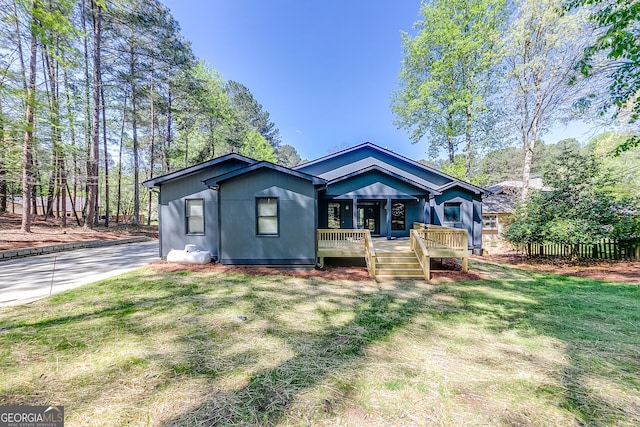 1762 Green Rd, Buford, GA 30518 - rear view of house featuring a lawn