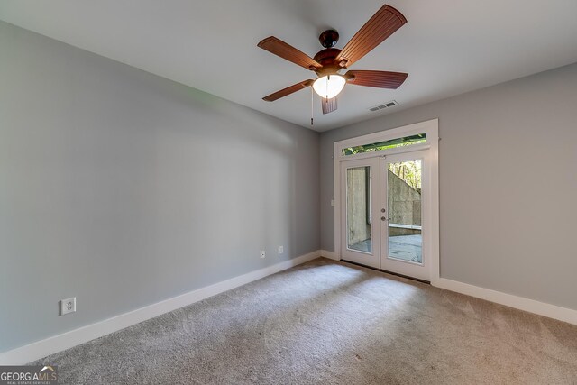 1762 Green Rd, Buford, GA 30518 - carpeted empty room featuring visible vents, baseboards, french doors, and ceiling fan