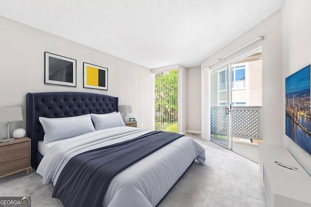 bedroom with light carpet and access to exterior