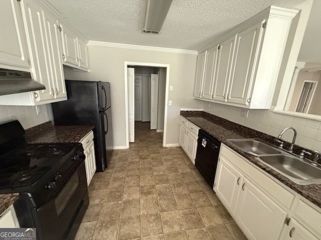 kitchen featuring under cabinet range hood, a sink, white cabinetry, and black appliances