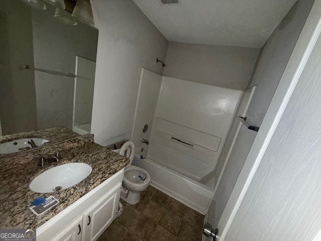 full bathroom featuring toilet, vanity, and shower / bathtub combination