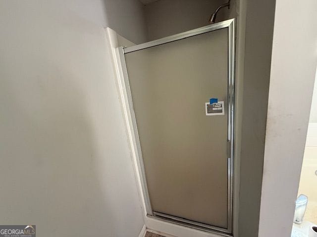 full bathroom featuring a stall shower