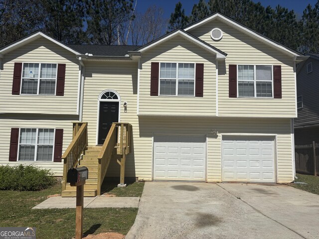 7455 Royal Ct, Riverdale, GA 30296 - split foyer home featuring driveway and an attached garage