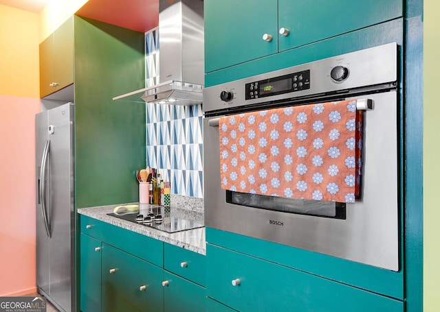 130 Arizona Ave NE Unit 415, Atlanta, GA 30307 - kitchen with wall chimney range hood, light countertops, and appliances with stainless steel finishes