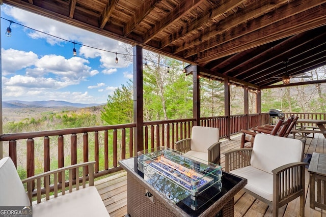 425 Rhonda Ln, Mineral Bluff, GA 30559 - deck featuring a mountain view, a fire pit, and a grill