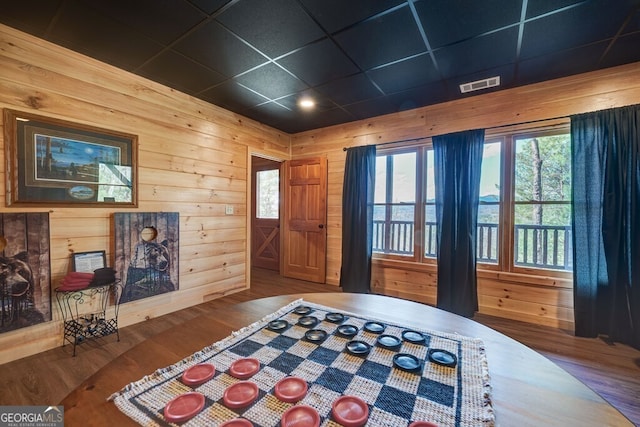 425 Rhonda Ln, Mineral Bluff, GA 30559 - bedroom with wood finished floors, multiple windows, and wood walls
