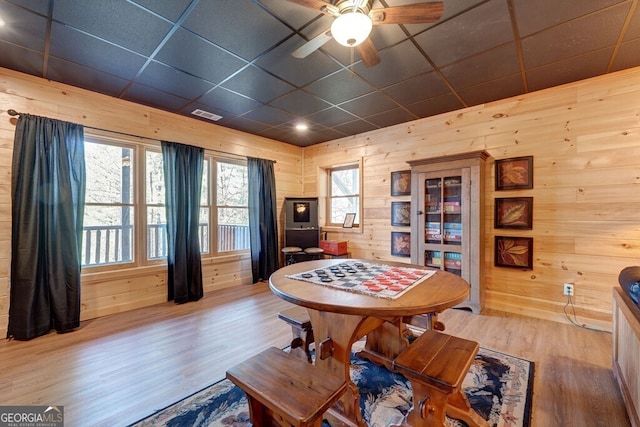 425 Rhonda Ln, Mineral Bluff, GA 30559 - dining room with wood finished floors, wooden walls, and a ceiling fan