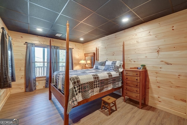 425 Rhonda Ln, Mineral Bluff, GA 30559 - bedroom featuring wood finished floors, wood walls, a paneled ceiling, and recessed lighting