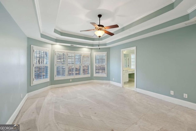 5615 Toccoa Dr, Douglasville, GA 30135 - carpeted empty room with a tray ceiling, ornamental molding, baseboards, and a ceiling fan