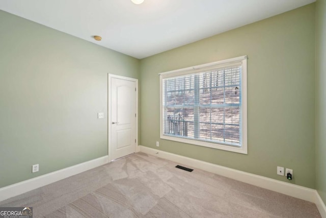5615 Toccoa Dr, Douglasville, GA 30135 - spare room with baseboards, carpet, and visible vents