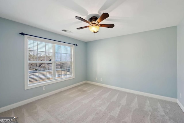 5615 Toccoa Dr, Douglasville, GA 30135 - spare room featuring baseboards, visible vents, light colored carpet, and a ceiling fan
