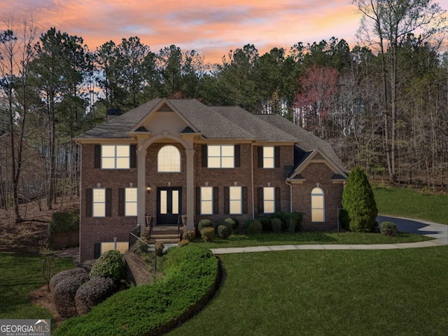 5615 Toccoa Dr, Douglasville, GA 30135 - view of front facade featuring a yard and brick siding