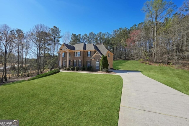 5615 Toccoa Dr, Douglasville, GA 30135 - colonial inspired home with concrete driveway and a front lawn
