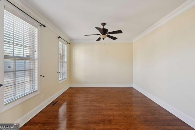5615 Toccoa Dr, Douglasville, GA 30135 - empty room with wood finished floors, ceiling fan, baseboards, and ornamental molding
