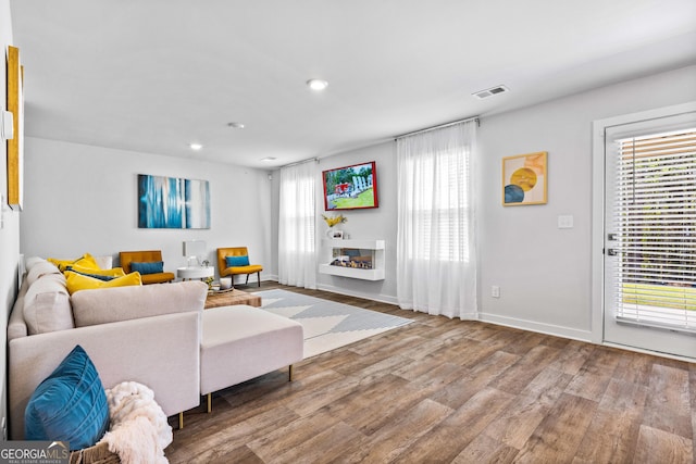 219 Rusty Plow Ln Unit 69, Perry, GA 31069 - living area featuring wood finished floors, baseboards, and visible vents
