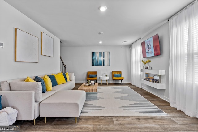 219 Rusty Plow Ln Unit 69, Perry, GA 31069 - living area featuring visible vents, baseboards, recessed lighting, wood finished floors, and stairs