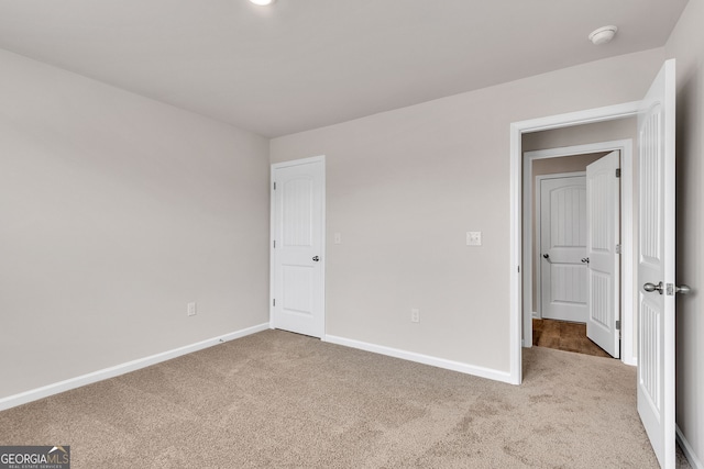 219 Rusty Plow Ln Unit 69, Perry, GA 31069 - unfurnished bedroom featuring carpet flooring and baseboards