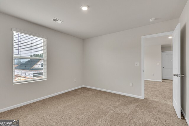 219 Rusty Plow Ln Unit 69, Perry, GA 31069 - spare room featuring light carpet, baseboards, and visible vents