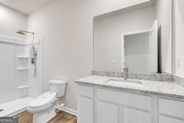 219 Rusty Plow Ln Unit 69, Perry, GA 31069 - bathroom featuring a stall shower, wood finished floors, and vanity