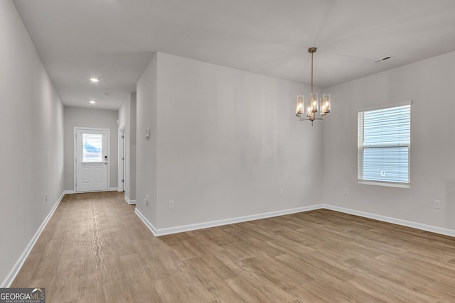 219 Rusty Plow Ln Unit 69, Perry, GA 31069 - spare room with wood finished floors, a chandelier, and recessed lighting