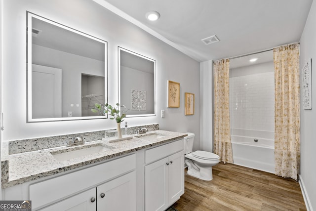 219 Rusty Plow Ln Unit 69, Perry, GA 31069 - full bath with toilet, wood finished floors, a sink, and visible vents
