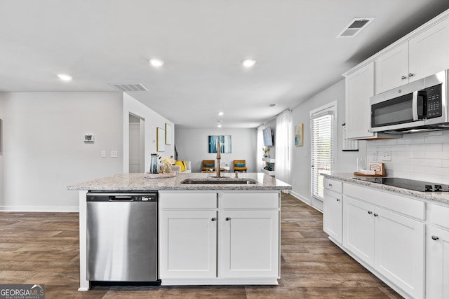 219 Rusty Plow Ln Unit 69, Perry, GA 31069 - kitchen with appliances with stainless steel finishes, visible vents, a center island with sink, dark wood finished floors, and a sink