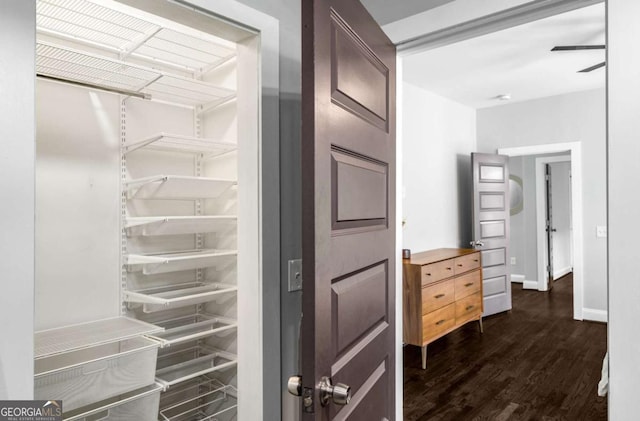 interior space with wood finished floors and baseboards
