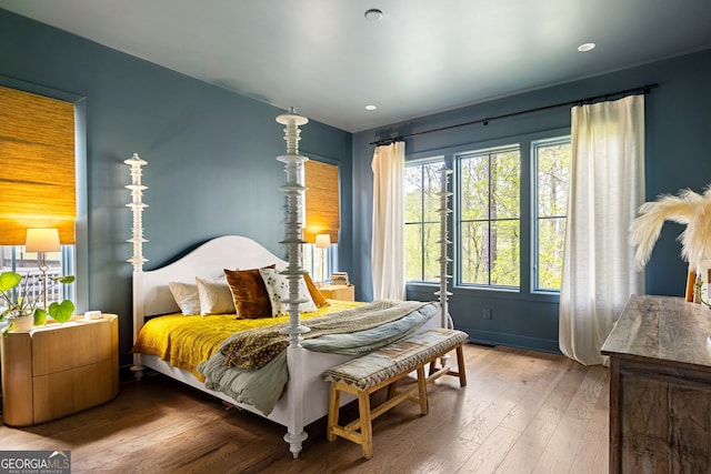 bedroom with recessed lighting and hardwood / wood-style floors