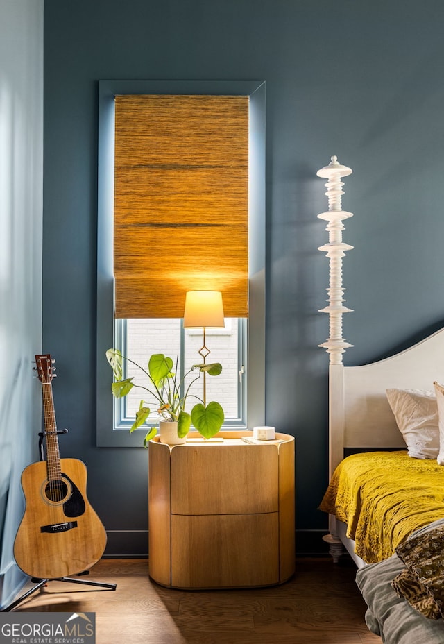 bedroom with wood finished floors