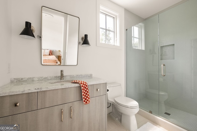 full bathroom with tile patterned floors, toilet, a shower stall, and vanity