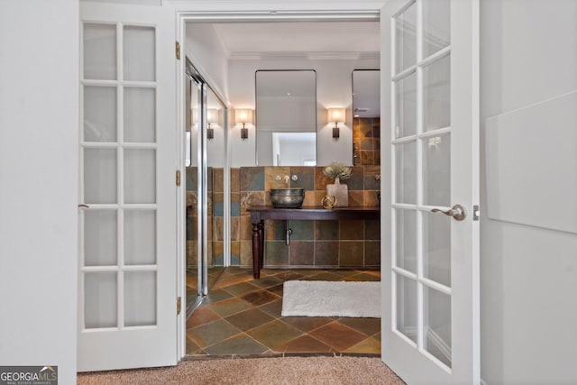 hall featuring french doors and ornamental molding