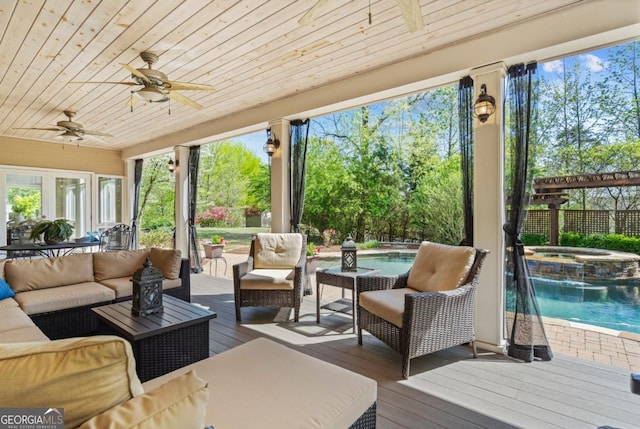 exterior space with a jacuzzi, ceiling fan, and an outdoor hangout area