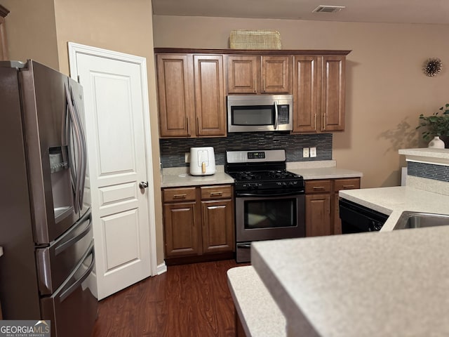 3627 Mcclaren Way, Lawrenceville, GA 30044 - kitchen featuring dark wood-type flooring, tasteful backsplash, visible vents, light countertops, and stainless steel appliances