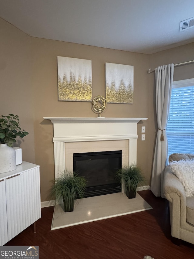 3627 Mcclaren Way, Lawrenceville, GA 30044 - living room with visible vents, baseboards, wood finished floors, and a glass covered fireplace