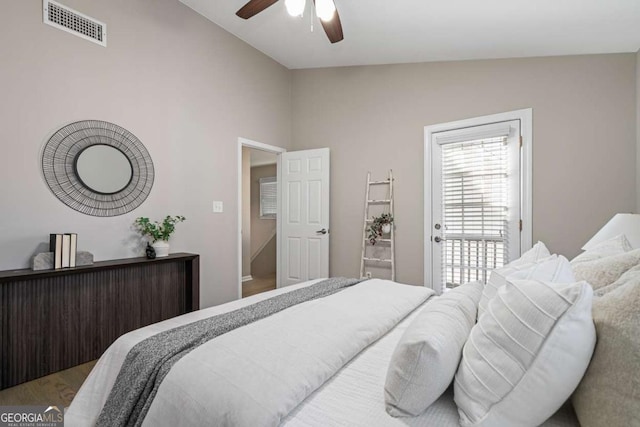 bedroom featuring a ceiling fan, vaulted ceiling, and visible vents