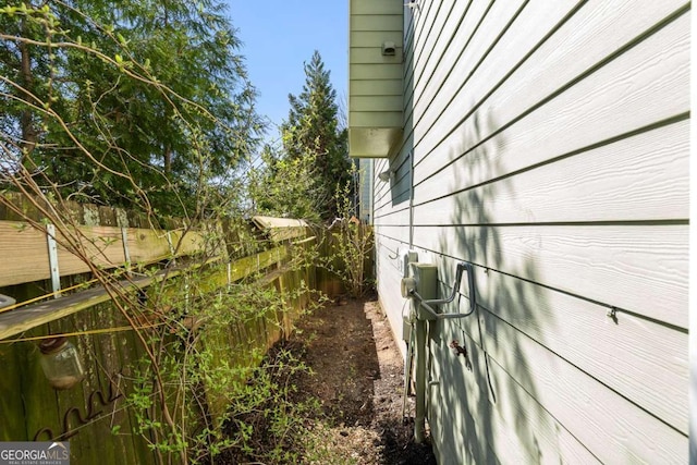 view of home's exterior featuring fence