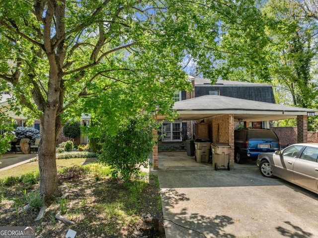 6500 Gaines Ferry Rd, Flowery Branch, GA 30542 - view of front of property featuring brick siding, an attached carport, and concrete driveway