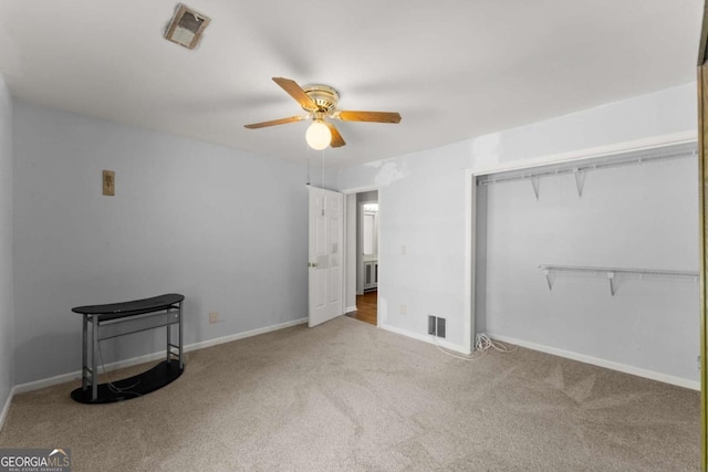 6500 Gaines Ferry Rd, Flowery Branch, GA 30542 - unfurnished bedroom with ceiling fan, a closet, visible vents, carpet flooring, and baseboards