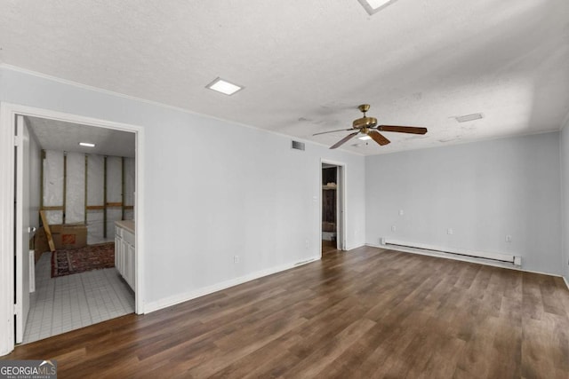 6500 Gaines Ferry Rd, Flowery Branch, GA 30542 - empty room featuring visible vents, a ceiling fan, a textured ceiling, baseboard heating, and wood finished floors