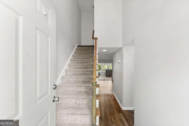 6500 Gaines Ferry Rd, Flowery Branch, GA 30542 - stairs with baseboards and wood finished floors