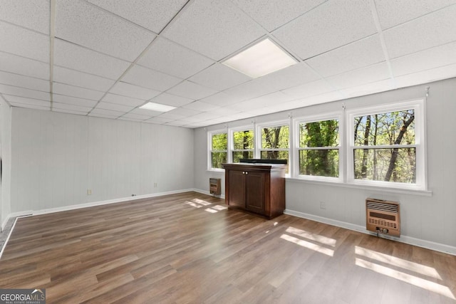6500 Gaines Ferry Rd, Flowery Branch, GA 30542 - interior space featuring a paneled ceiling, heating unit, wood finished floors, and baseboards