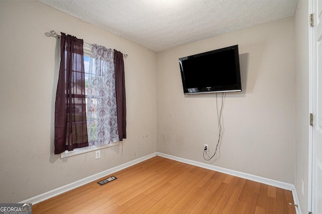 130 Manning Mill Rd NW, Adairsville, GA 30103 - unfurnished room featuring wood finished floors, a textured ceiling, and baseboards