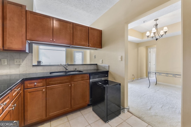 1250 Parkwood Cir SE Unit 2310, Atlanta, GA 30339 - kitchen with a sink, light colored carpet, a chandelier, and brown cabinets