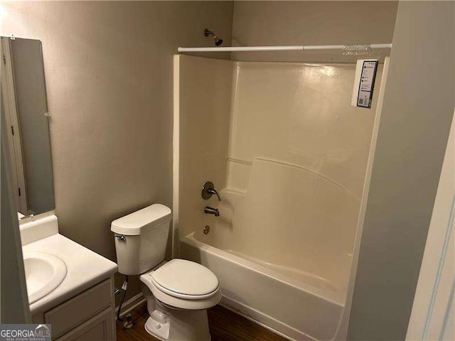 full bath featuring toilet, vanity, and shower / bathtub combination