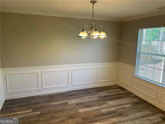 unfurnished dining area with dark wood-style flooring, a chandelier, a decorative wall, and visible vents