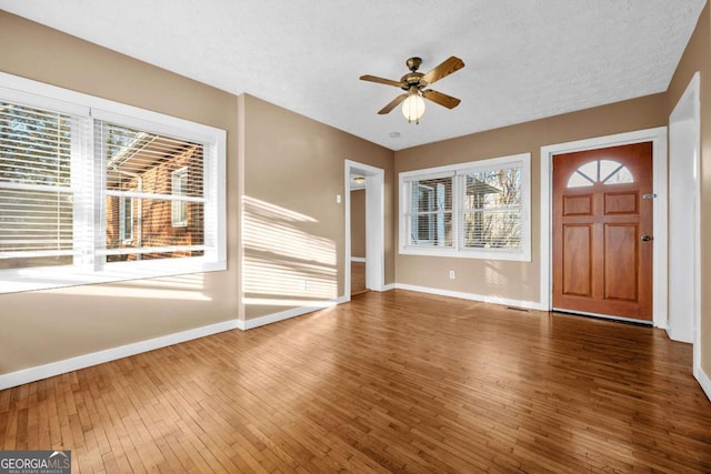 340 Lavista Dr, Blue Ridge, GA 30513 - entrance foyer featuring wood-type flooring, ceiling fan, baseboards, and a textured ceiling