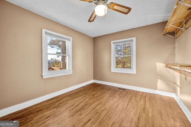 340 Lavista Dr, Blue Ridge, GA 30513 - unfurnished room featuring visible vents, baseboards, a ceiling fan, a textured ceiling, and wood finished floors